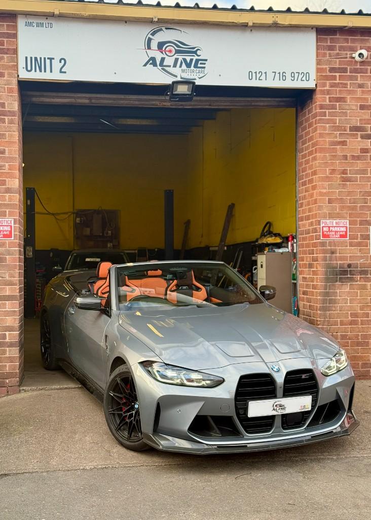BMW M4 at the Aline Motor Care workshop entrance, Birmingham B37