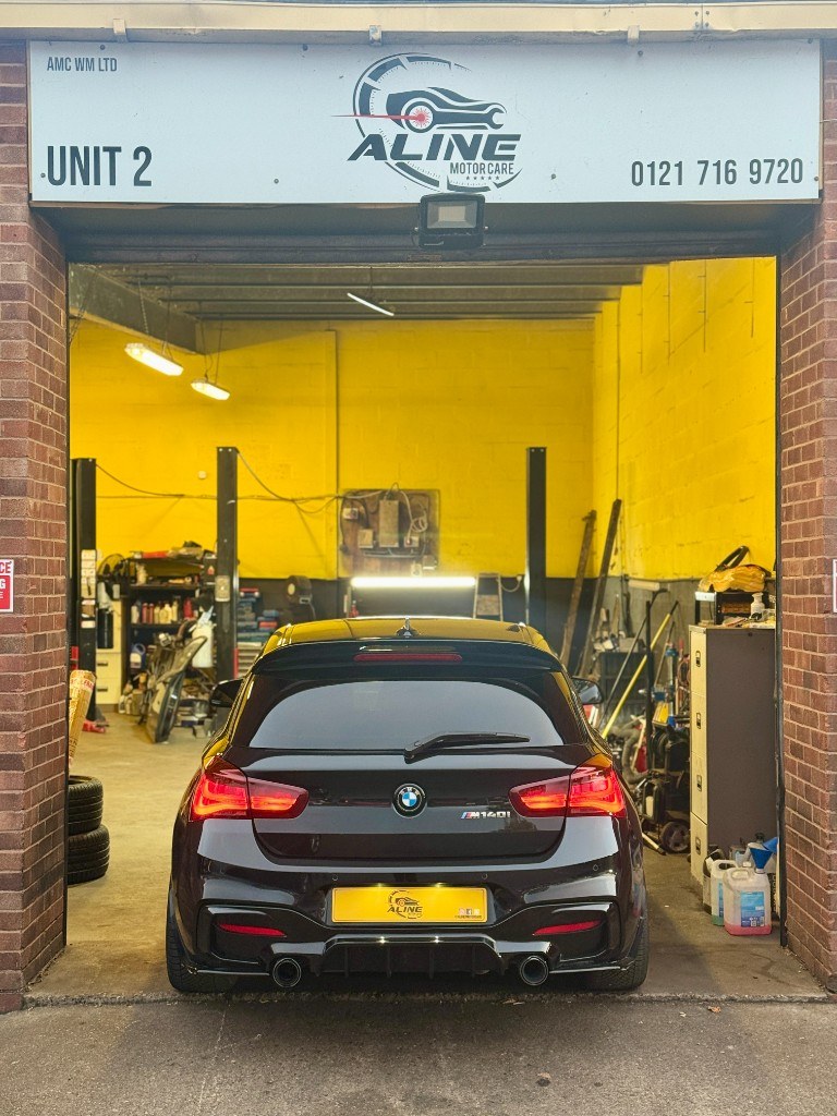 Aline Motor Care workshop bay with yellow interior and specialist equipment